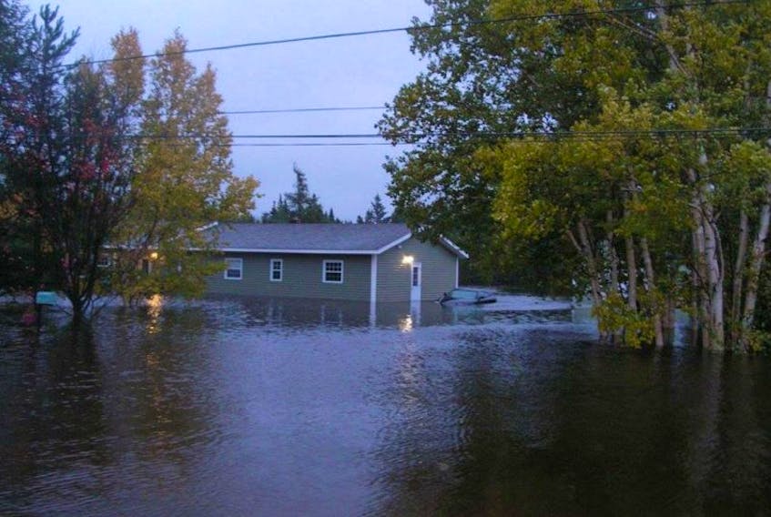 Flooding damaged homes in Brown's Arm, NL, last year. Climate change may make overland flooding a larger risk for for Canadian homeowners. 