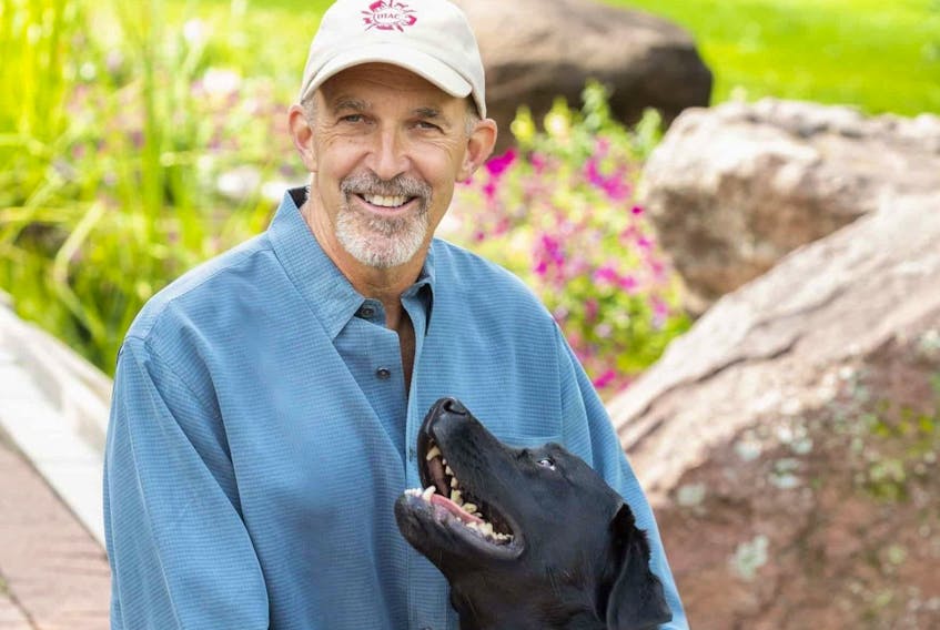 Phil Tedeschi, a human/animal connection expert, with his family dog