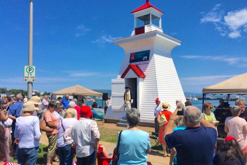 <p>Greg Turner as Admiral Digby obliges another photographer during the celebration of the return and restoration of the Digby Pier Light on July 23.</p>