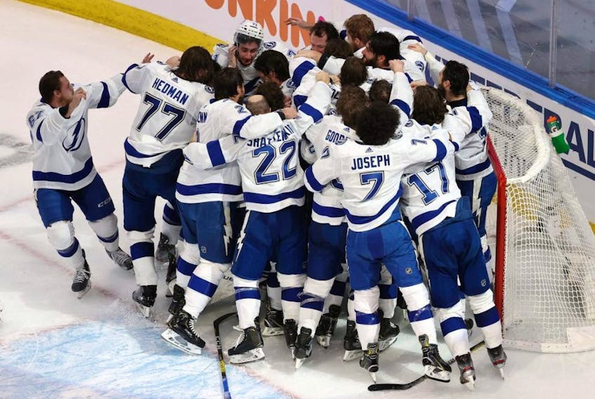 The Lightning celebrate following the series-winning 2-0 victory over the Stars in Game 6 of the 2020 NHL Stanley Cup Final at Rogers Place in Edmonton, Monday, Sept. 28, 2020.