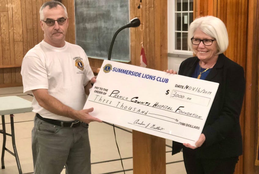 King Lion Mike Arsenault of the Summerside Lions presents a cheque for $3,000 to Arlene Gallant Bernard for the Prince County Hospital Foundation on the occasion of the Club's 65th anniversary.