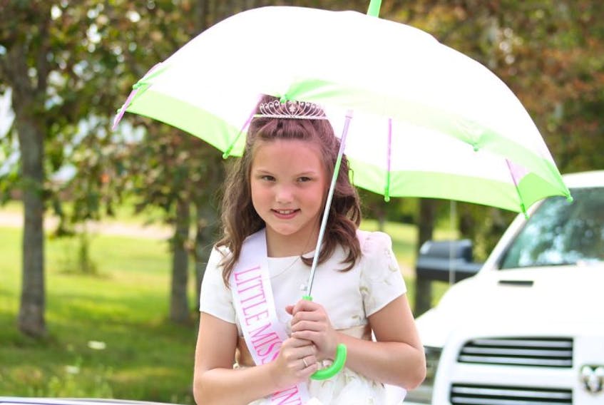 Little Miss Canning 2014, eight-year-old Addison Rogers, waits for the Grand Street Parade to begin.