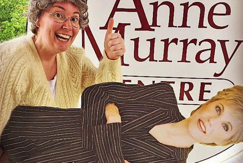 Heather MacIntyre as Ma tries to steal a cut-out of her favourite singer from the Anne Murray Centre.