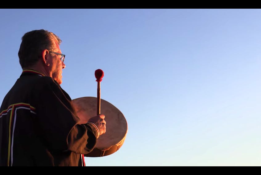 Junior Peter-Paul plays his drum during a sunrise ceremony, opening prayer and honour song at the start of the National Indigenous Peoples Day celebrations hosted by L’nuey P.E.I. in this screenshot of a YouTube video.