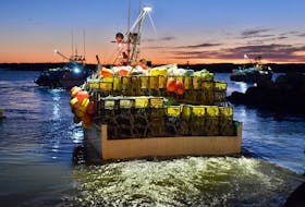 Lobster vessels loaded with traps depart from a wharf in Pinkney’s  on dumping day morning in 2019. Following a one-day delay due to wind, boats in LFA 34 left at 7 a.m. rather than their normal 6 a.m. departure time. TINA COMEAU PHOTO