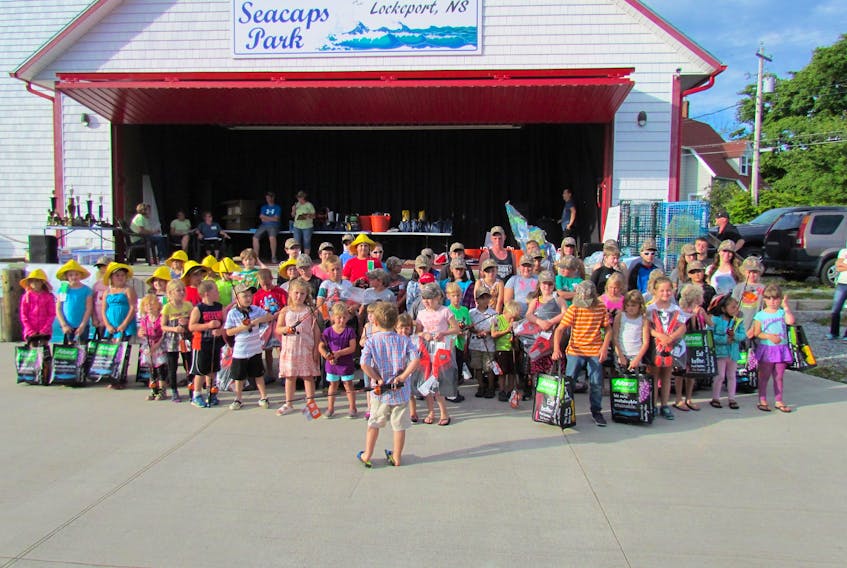 Children pose with their fishing rods and prizes for a group photo at last year's Lockeport Sea Derby. This year's derby will run from Aug.  9 to 11.