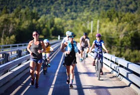 Tanya Joy was overwhelmed with all the support she received during her gruelling trek in a 100-kilometre course near Steady Brook on the west coast of the province. At one point along the course, children from the area, riding their bikes, rode alongside her for support. — CONTRIBUTED