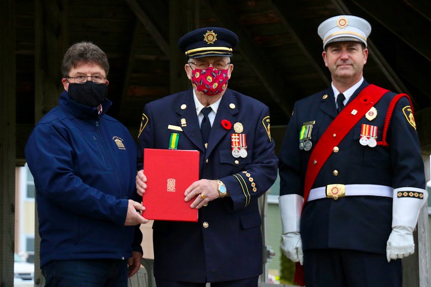Hants West MLA Chuck Porter presented a special certificate to Cyril Woodman to celebrate his 90th birthday. Also pictured is Lt. Chris Sullivan, the Windsor Fire Department’s colour party parade marshal.