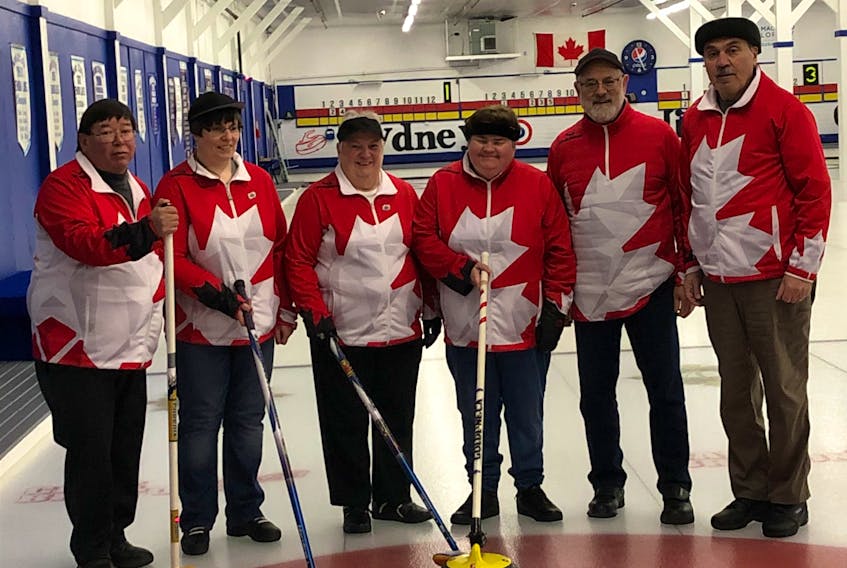 After winning the championship last February, the Louise Gillis rink will defend its title this year as Team Canada when they participate in the Canadian Visually Impaired Curling Championship in Ottawa this week. Members of the team, from left, Sidney Francis (coach/guider), Terrylynn MacDonald, Louise Gillis, Mary Campbell, Garth Nathanson (coach/guider) and John Marusiak (coach/guider). PHOTO SUBMITTED/LOUISE GILLIS.