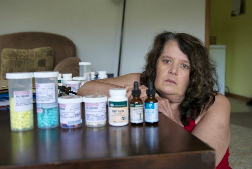 <p>Annette Hyson sits next to an array of pills and drops she takes for the many Lyme disease related symptoms she has.&nbsp; Annette and a doctor who deals with Lyme disease believe she has a chronic version of the disease.&nbsp;</p>