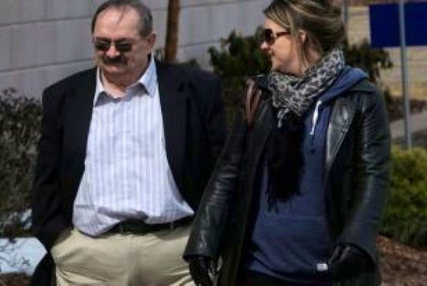 <span>John Leonard MacKean and his daughter arrive at court in March 2014 in Bridgewater. MacKean, 65, who was convicted in the case of a Nova Scotia teen who was kidnapped, chained and sexually assaulted, died of natural causes on Wednesday.<br /></span>