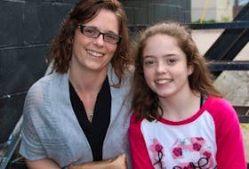 <p>MacKenzie Warren and her mother Jennifer take a moment to relax.</p>