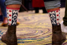  A supporter of U.S. President Donald Trump wears Make America Great Again socks at a Republican election night party in Edmond, Oklahoma, on Nov. 3, 2020.