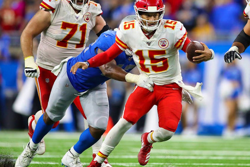 Patrick Mahomes of the Kansas City Chiefs runs for a first down while playing the Detroit Lions at Ford Field on September 29, 2019 in Detroit. (Photo by Gregory Shamus/Getty Images)