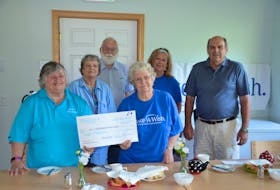 Make-A-Wish Canada volunteers Millie Clements, Julia and Walter Ellis, Betty Hebb and Sharon Gillis accept a cheque presented by Coun. Paul Spicer on behalf of the County of Kings. KIRK STARRATT