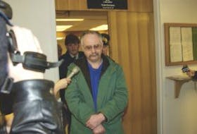 ['Malcolm Norman Cuff, 52, is seen leaving a Corner Brook court room in this file photo.']