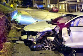 One man was sent to hospital after the car he was driving struck a parked car in St John's early Saturday morning. Keith Gosse/The Telegram