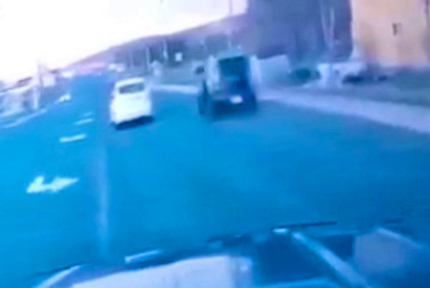 A still shot from a video taken from a vehicle dash cam shows a black Kia Soul moments before a deadly crash on Topsail Road in St. John's. The video is at the heart of an investigation as to why the video, which was given to police, might have gotten into the hands of someone in the public. — CONTRIBUTED