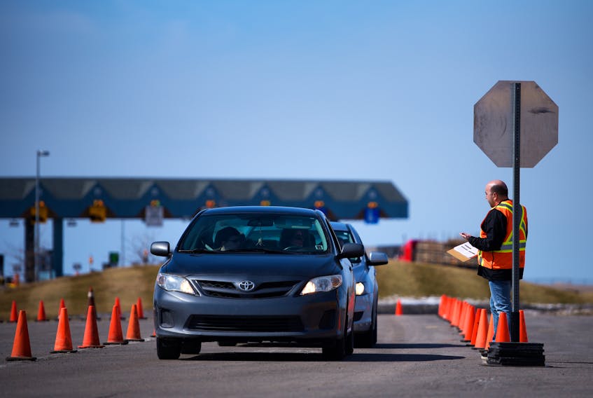 Cars wait in line in March at the Covid-19 checkpoint at the Confederation Bridge in Borden-Carleton. Nathan Rochford/The Guardian