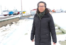 Veronika Brzeski stands near the North Sydney wharf. The executive director of the Cape Breton Fish Harvesters Association says she expects both certain and uncertain challenges in this year's lobster season. ERIN POTTIE/CAPE BRETON POST