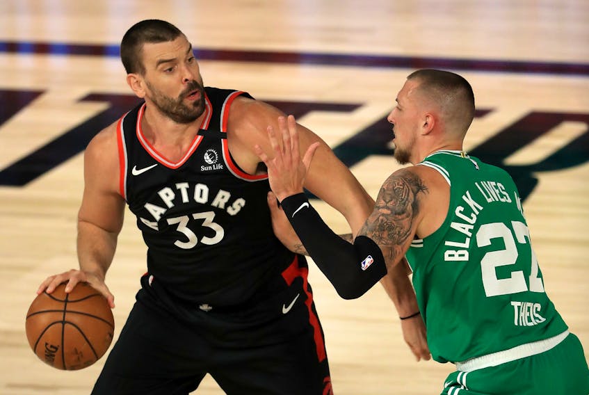 Raptors' Marc Gasol drives the ball against Daniel Theis of the Boston Celtics during Game 6 of their Eastern semifinal in Lake Buena Vista, Fla. 