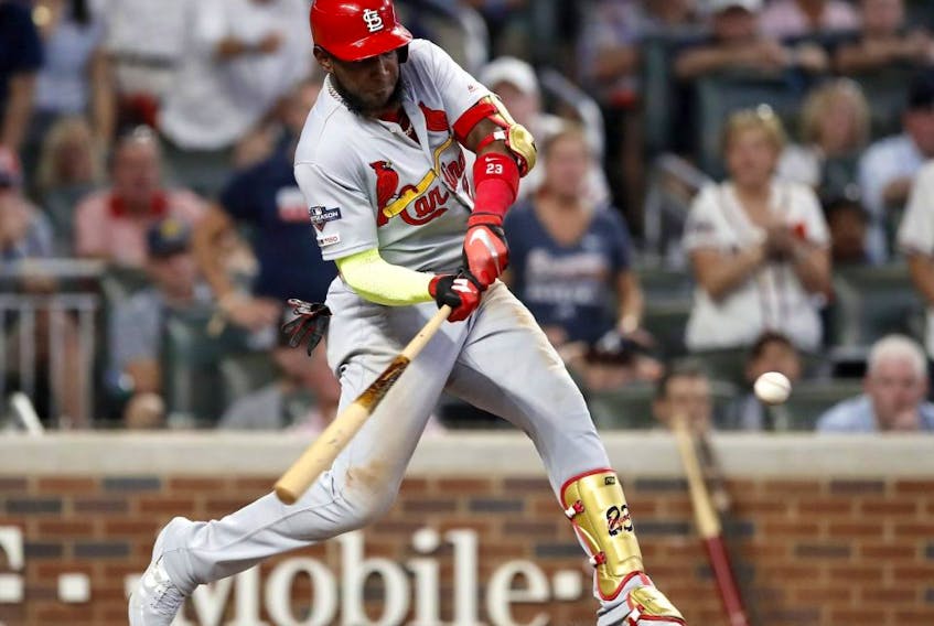 Cardinals batter Marcell Ozuna hits a two-run double against the Braves during ninth inning action in Game 1 of the National League Division Series at SunTrust Park in Atlanta, on Thursday, Oct. 3, 2019.