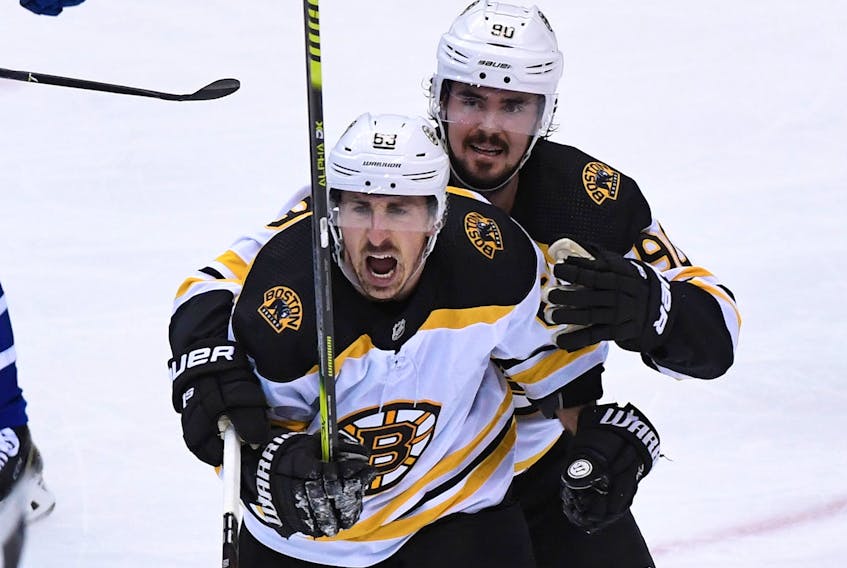 Boston Bruins forward Brad Marchand (63) celebrates with forward Marcus Johansson (90) after scoring a goal against the Toronto Maple Leafs in the first period in game six of the first round of the 2019 Stanley Cup Playoffs at Scotiabank Arena. - Dan Hamilton / USA TODAY Sports