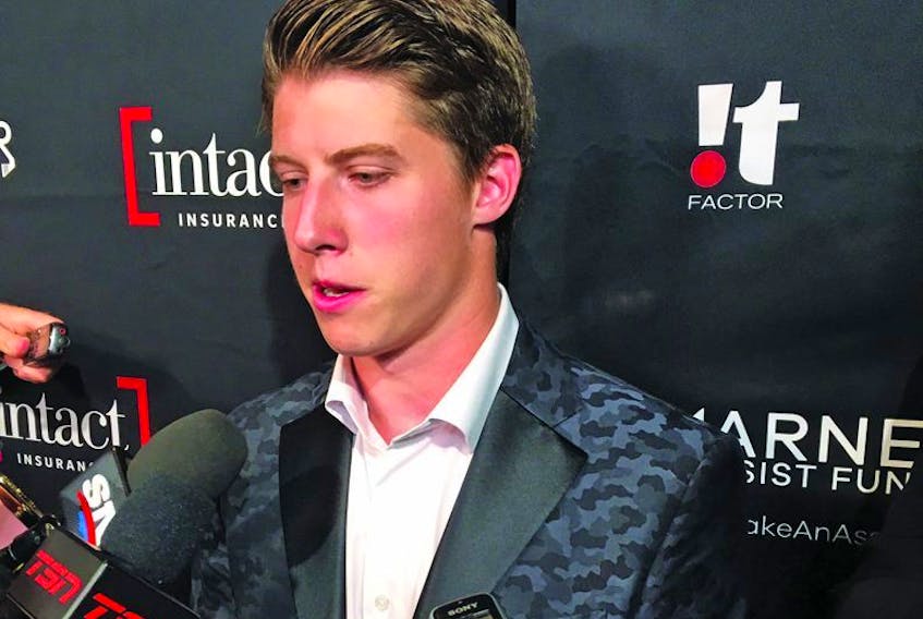 Mitch Marner holds court with reporters last night at his annual charity event.          LANCE HORNBY/TORONTO SUN