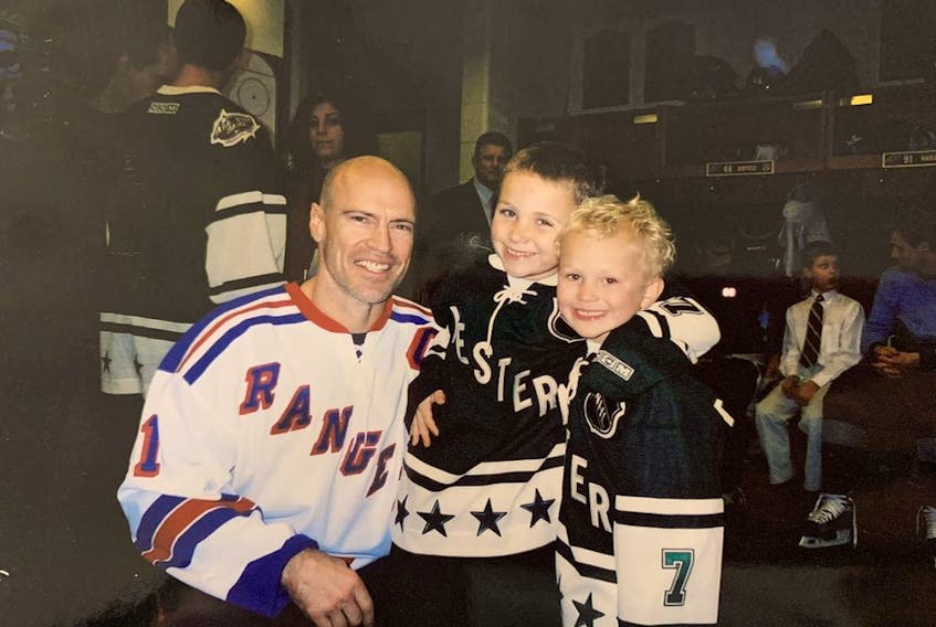 Mark Messier with Matthew and Brady Tkachuk at the 2004 All-Star game in Saint Paul, Minn. 