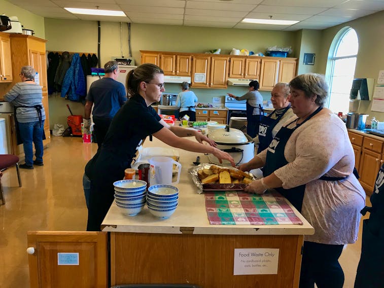 Preparing lunch in the kitchen at Yarmouth Wesleyan Church, one of the venues for Yarmouth’s 100 Meals program, which has concluded for another year. ERIC BOURQUE