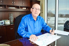 Membertou First Nation Chief Terry Paul reviews blueprints for the Churchill Crossing development that will begin construction this summer. It is located along the newly twinned section of Highway 125, connected to the aboriginal community via highway interchange. <br /><br />