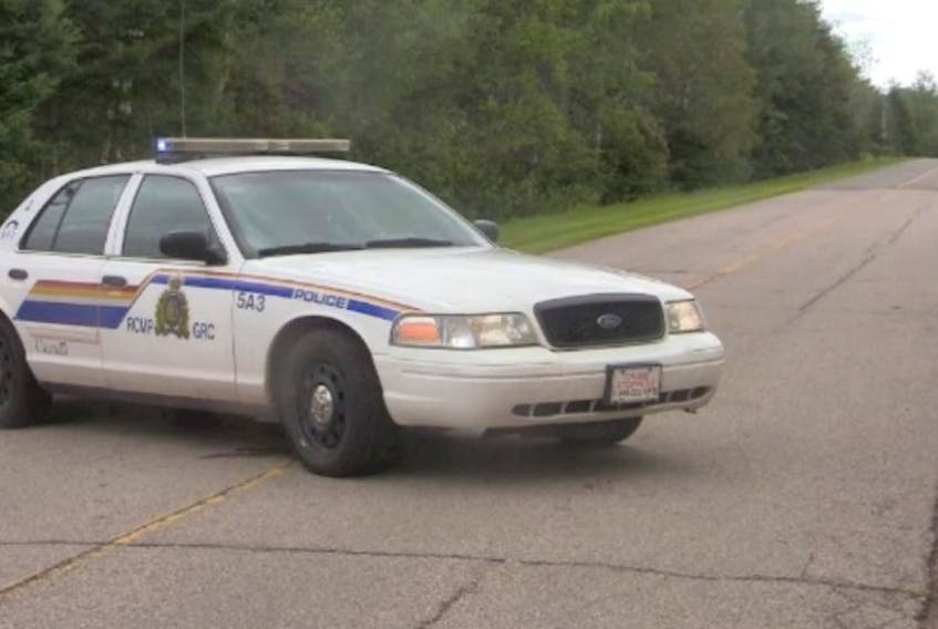 An RCMP vehicle blocks off the St. Marys Road near Montague in August 2014 after the shooting deaths of Brent McGuigan and his adult son, Brendan.