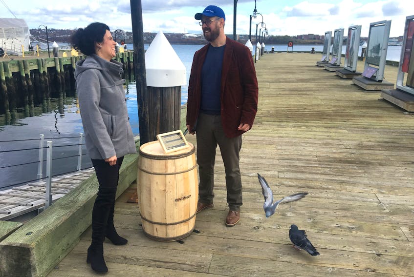 Peter Cullen, executive director of Ross Farm Museum, and Cathy Hamel, educational outreach co-ordinator at the museum, set up on the Halifax waterfront Tuesday, Nov. 5, 2019 with an apple barrel celebrating Edward Ross's 19th-century trading career between New Ross and the traders of Halifax.