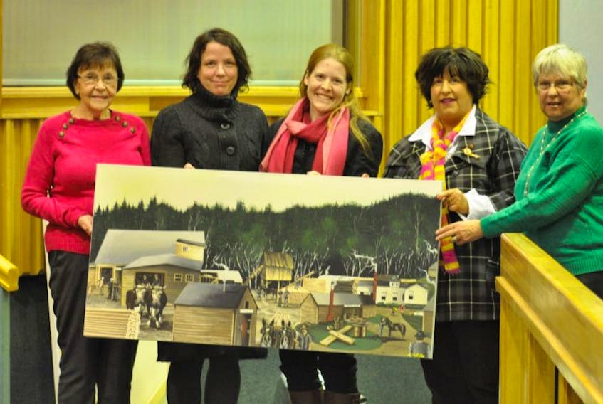 From left, Dorene McMaster, consultant Angela Morin, recreation director Meg Cuming, Warden Diana Brothers and Peggy McNeil presented the original panels&nbsp; depicting McMaster Mill to the county as a memento of the project.