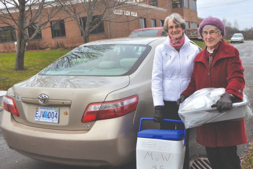 <p>Sylvia Campbell, left, and Claire MacDonnell picked up several meals from Valley View Villa on Thursday on MacDonnell’s last day with Meals on Wheels. AMANDA JESS – THE NEWS</p>
<p>&nbsp;</p>