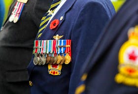 Royal Canadian Legion members display their medals during a Remembrance Day service in Madoc, Ont., in 2015.