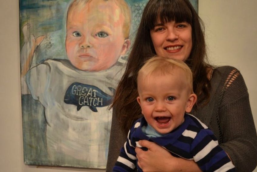P.E.I. artist Melissa Morse holds her 16-month-old son Ivan, the model for this painting. Great Catch is one of the pieces in Melissa Morse: Drawing on Pogey: Reports from the State of Domestic Bliss, which is on view at the Gallery @ the Guild in Charlottetown until Jan. 10.<br /><br />