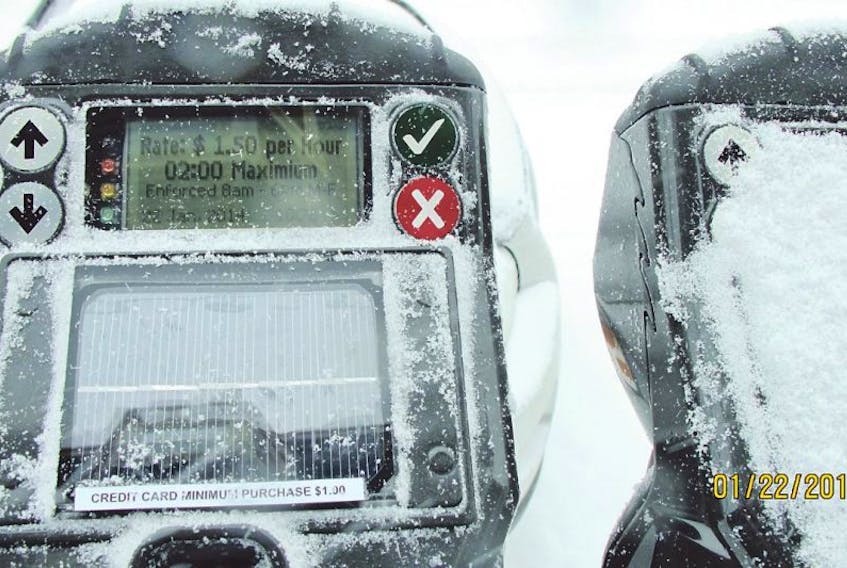 The parking meter on the left refused Susan Flanagan’s new parking card six times, but the one on the right accepted it after three tries. — Photo by Susan Flanagan/Special to The Telegram