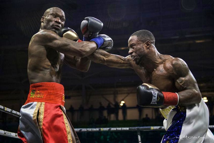 Custio Clayton, right, lands a shot against DeMarcus Corley during a welterweight fight on March 29 in Toronto. Clayton scored a sixth-round TKO of Corley, a former WBO light welterweight champion. - METTE NIELSON