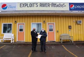 The Miawpukek First Nation recently bought the Exploits River Motel and the adjacent property. The property is the start for a multi-year tourism strategy that the band is developing. Shown here are Miawpukek First Nation Chief Mi’sel Joe (left) and previous vendor Henry Hutchings. Contributed photo  