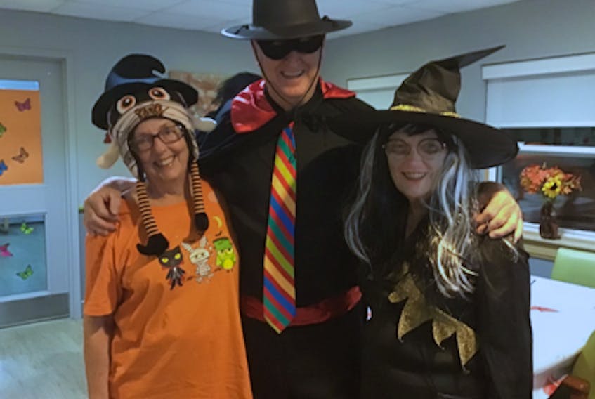 Rotarian Linda Crockett, bingo caller Ray MacNeil and Carol Miller get into the spirit during one of the Halloween celebrations at the New Dawn Guest Home. CONTRIBUTED