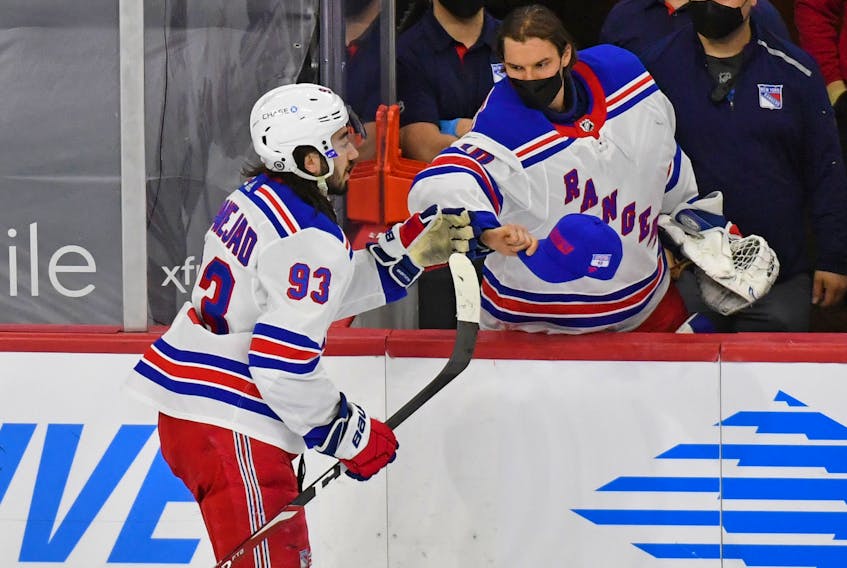 New York Rangers centre Mika Zibanejad is congratulated by goalie Alexandar Georgiev after completing his hat trick against Philadelphia last night. It was his second hat trick in eight days. He also added three assists against the Flyers. 