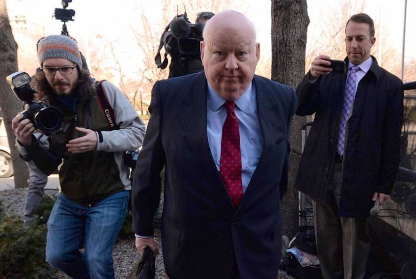 Suspended senator Mike Duffy arrives at the courthouse for his trial in Ottawa on Thursday.