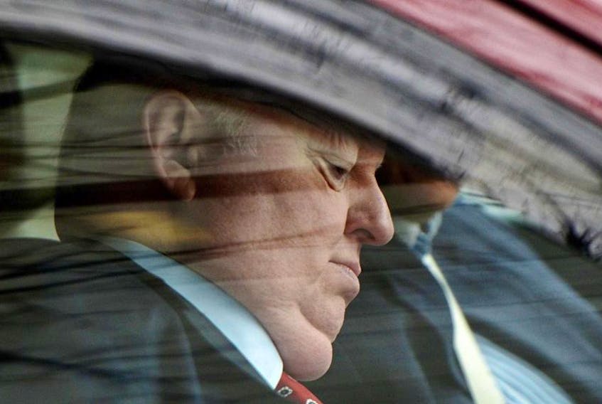 Suspended senator Mike Duffy arrives to the courthouse in Ottawa on Tuesday, April 21, 2015. Duffy is facing 31 charges of fraud, breach of trust, bribery, frauds on the government related to inappropriate Senate expenses.