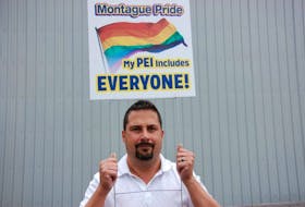 Mike Savidant, general manager of Sign Craft in Charlottetown, holds up one of the 30 signs he is donating for Montague residents to place on their lawns. Savidant, who lives just outside Montague, is disgusted by the municipality once again refusing to raise the pride flag.