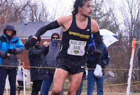 Mike Tate and his competitors battled muddy conditions during the 10k senior men’s race at the 2018 Canadian Cross Country Championships, which took place Nov. 24 in Kingston, Ontario. Athletics Canada