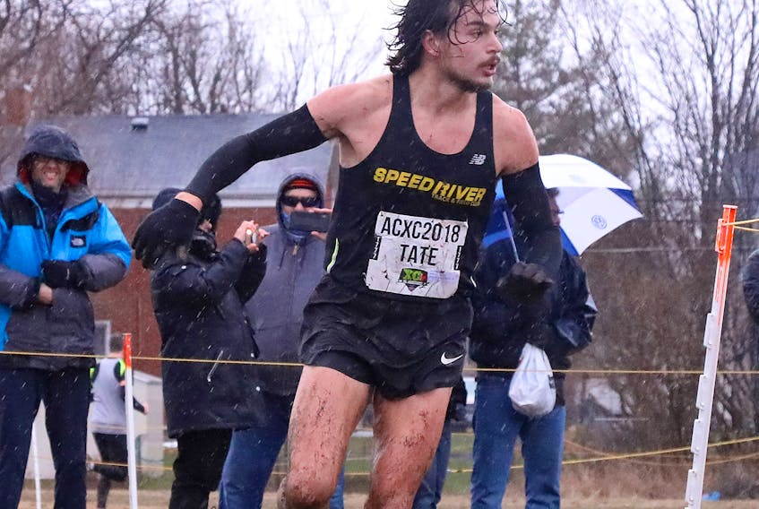 Mike Tate and his competitors battled muddy conditions during the 10k senior men’s race at the 2018 Canadian Cross Country Championships, which took place Nov. 24 in Kingston, Ontario. Athletics Canada
