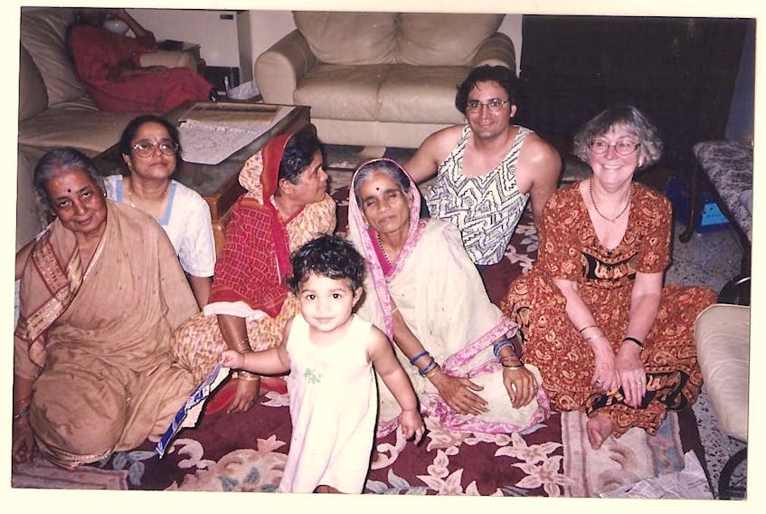 Emma (right) sits with family members during a return trip to India in 2002.