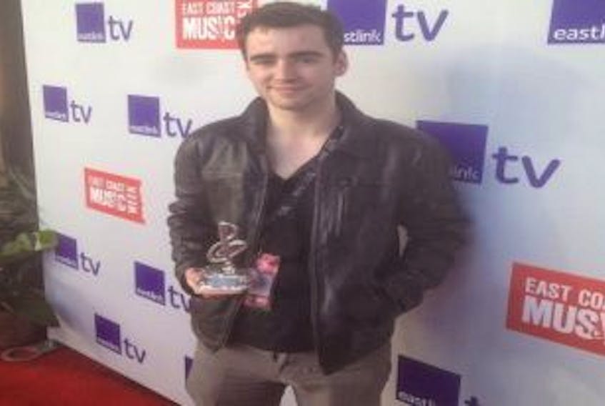 ['Shown in happier times with his 2014 ECMA Award, Berwick native Mitchell Pineo is safe in Nepal after the April 25 earthquake.']
