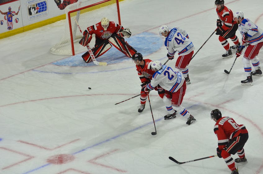 Summerside Western Capitals forward and team captain Brodie MacArthur releases a shot towards Pictou County Crushers goaltender Matthew Normore while being pressured by Keenan Gillis. Also following the play closely are the Caps’ Marc-Andre LeCouffe, 42, and Kallum Muirhead, 10, along with Sam LeBlanc, 6, and Aiden Hickey of the Crushers. MacArthur's third-period goal on the power play gave the Caps a 2-1 win in the Maritime Junior Hockey League game.